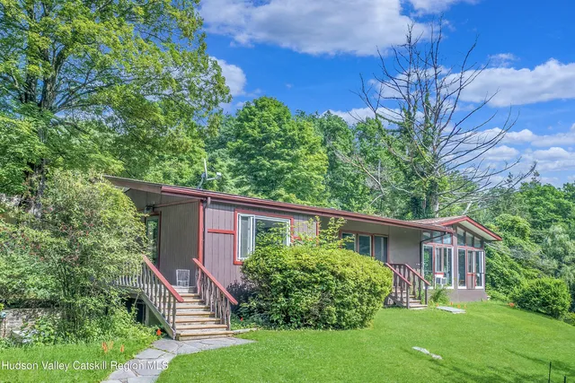 a aerial view of a house with a yard