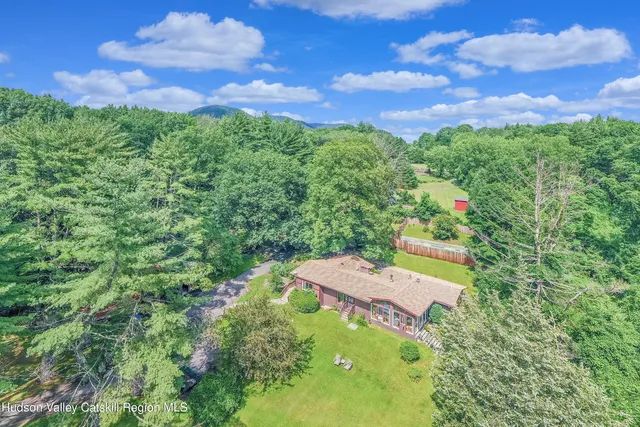 a view of a backyard with a small pool