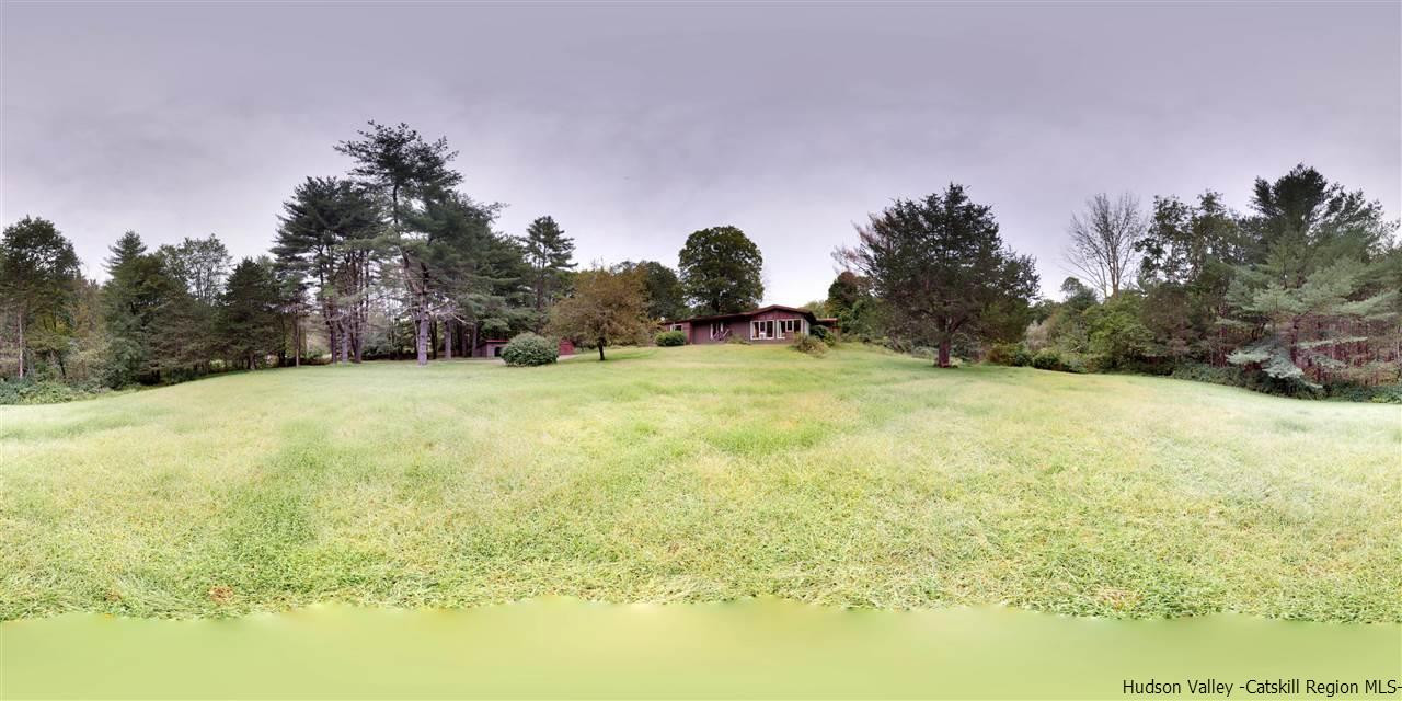 33 Race Track Road Bearsville, NY 12409 - Photo 37 of 37 a backyard of a house with lots of green space and outdoor seating