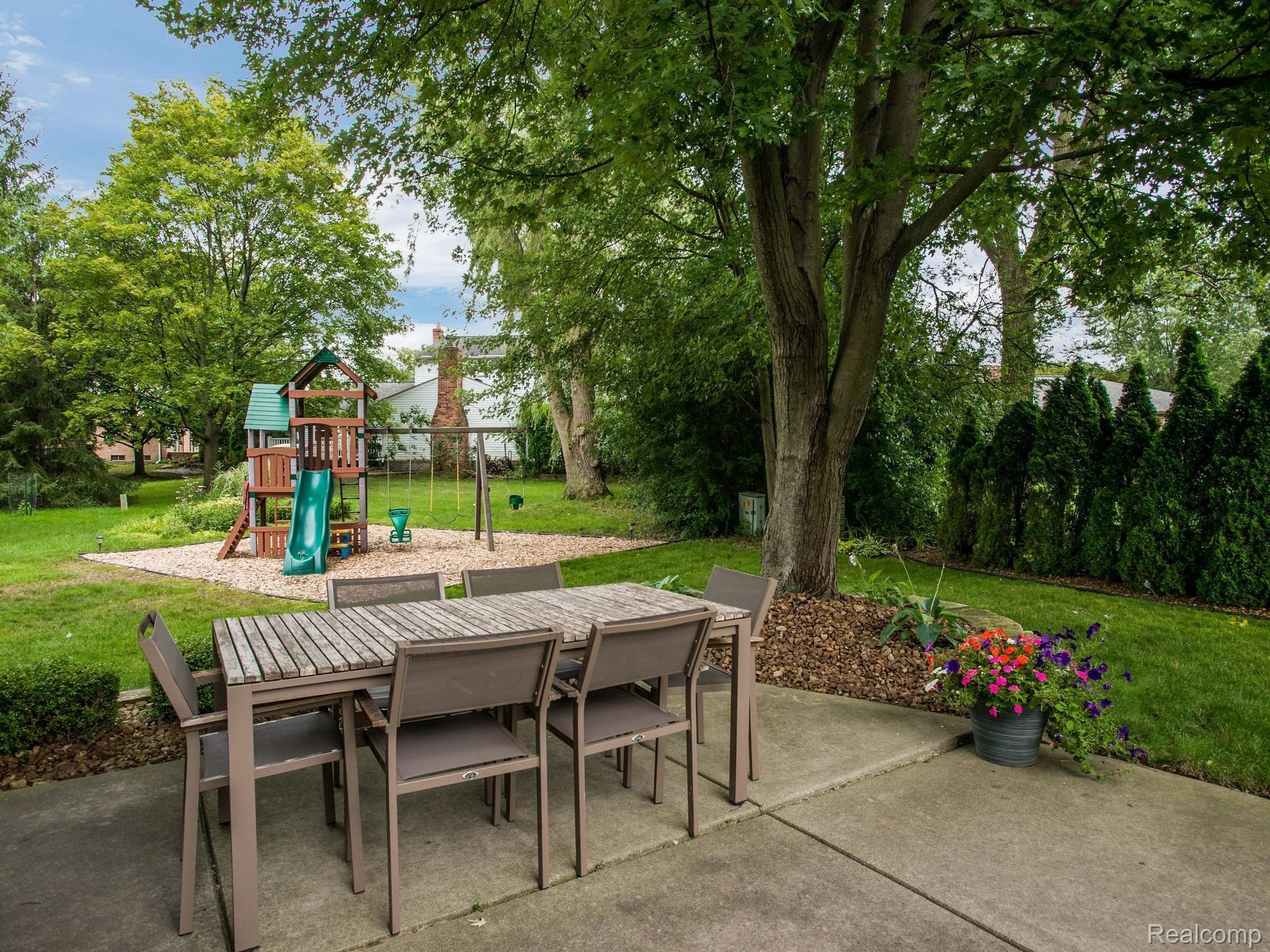 843 Dumont Place Rochester, MI 48307 - Photo 24 of 31 Large cul-de-sac yard with patio and playscape.