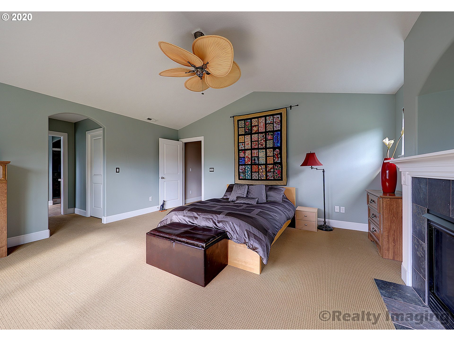 592 Southwest Elderbrook Place Portland, OR 97225 - Photo 18 of 30 a bedroom with a bed and a chandelier