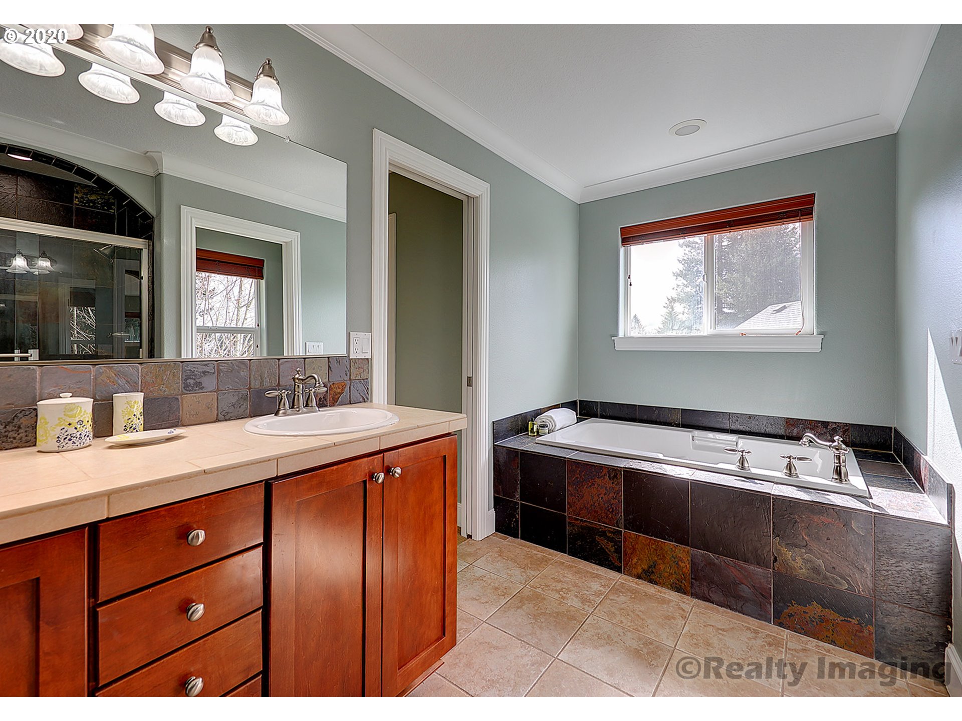 592 Southwest Elderbrook Place Portland, OR 97225 - Photo 20 of 30 a kitchen with a sink and chandelier