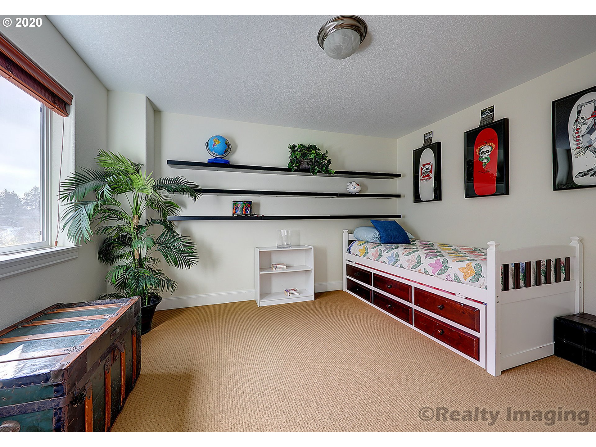 592 Southwest Elderbrook Place Portland, OR 97225 - Photo 24 of 30 a bedroom with furniture and a potted plant