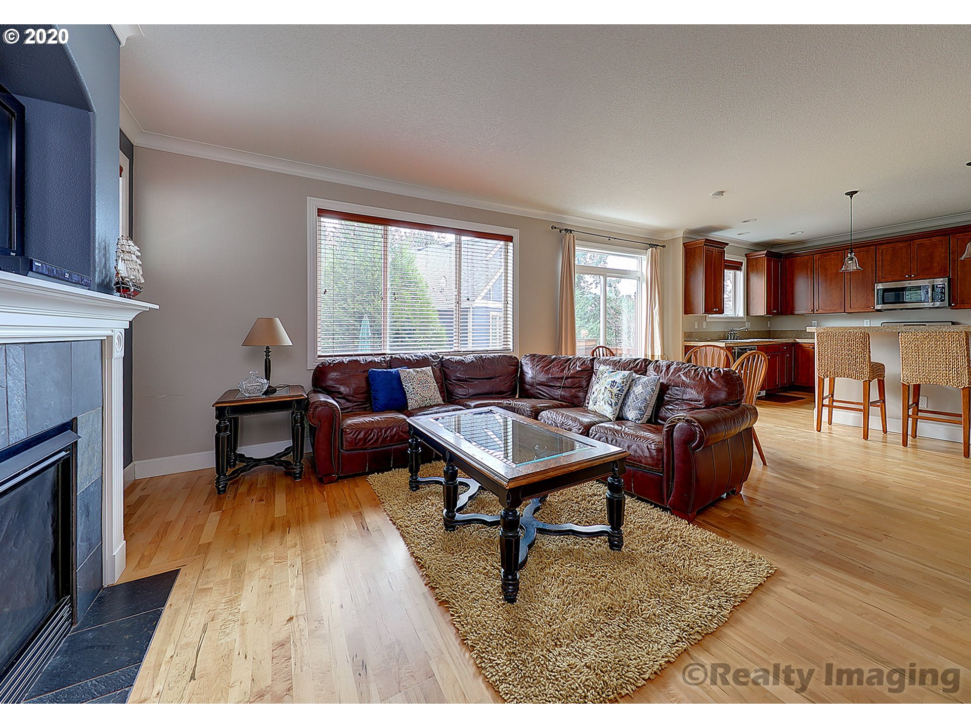 592 Southwest Elderbrook Place Portland, OR 97225 - Photo 7 of 30 a living room with furniture and a fireplace