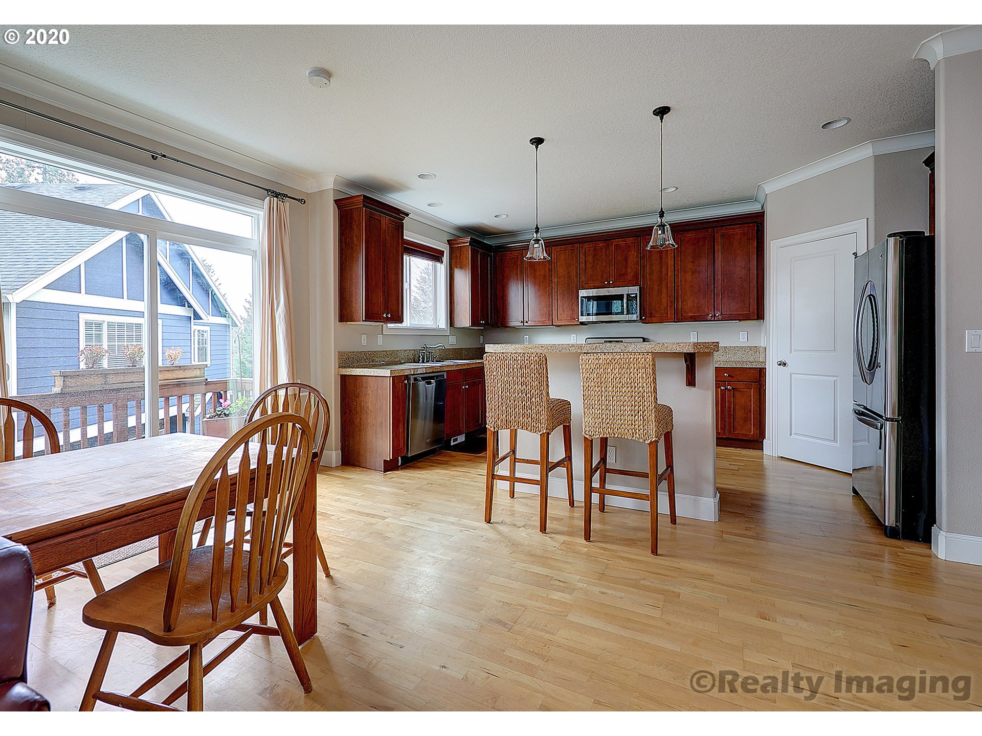 592 Southwest Elderbrook Place Portland, OR 97225 - Photo 8 of 30 a view of a dining room with furniture window and wooden floor