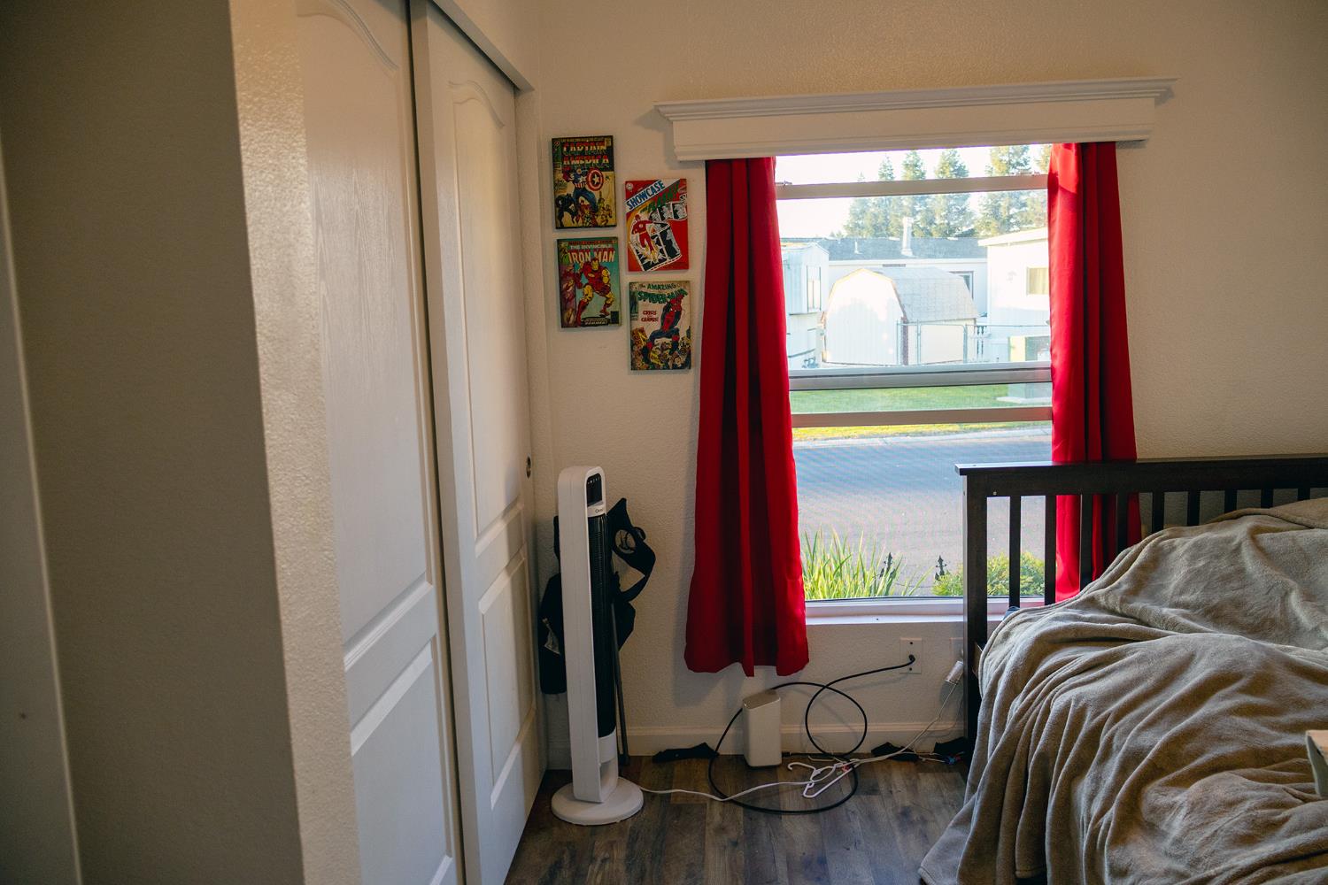 2499 East Gerard Avenue, Unit 123 Merced, CA 95341 - Photo 14 of 15 a view of bedroom with furniture and a window