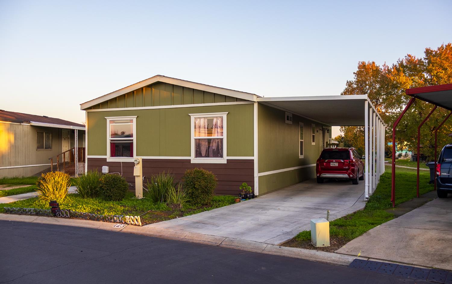 2499 East Gerard Avenue, Unit 123 Merced, CA 95341 - Photo 2 of 15 a front view of a house with garden
