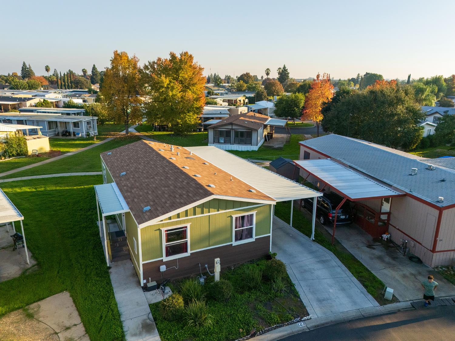 2499 East Gerard Avenue, Unit 123 Merced, CA 95341 - Photo 3 of 15 a view of a house with a yard