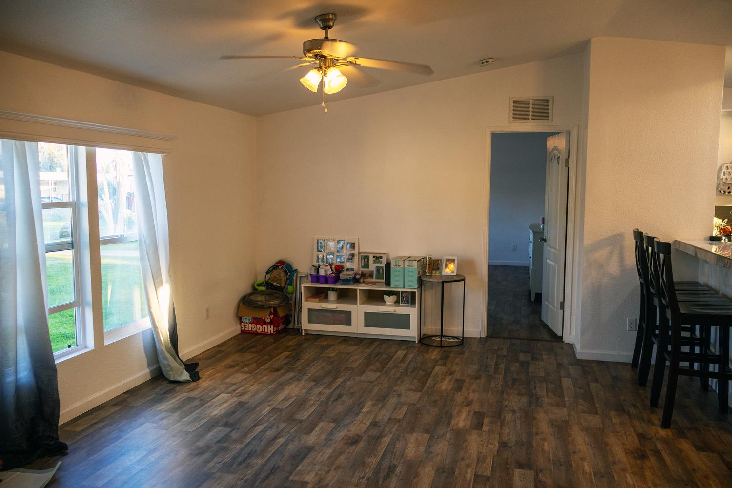 2499 East Gerard Avenue, Unit 123 Merced, CA 95341 - Photo 6 of 15 a view of a workspace with furniture and a window