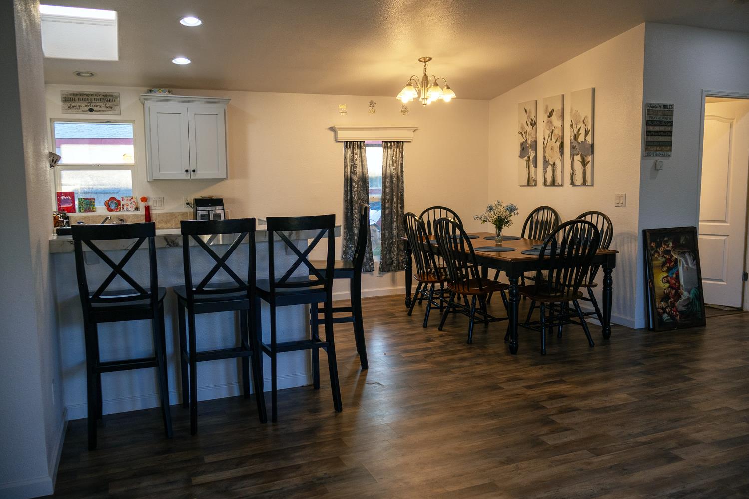 2499 East Gerard Avenue, Unit 123 Merced, CA 95341 - Photo 9 of 15 a view of a a dining room with furniture and wooden floor