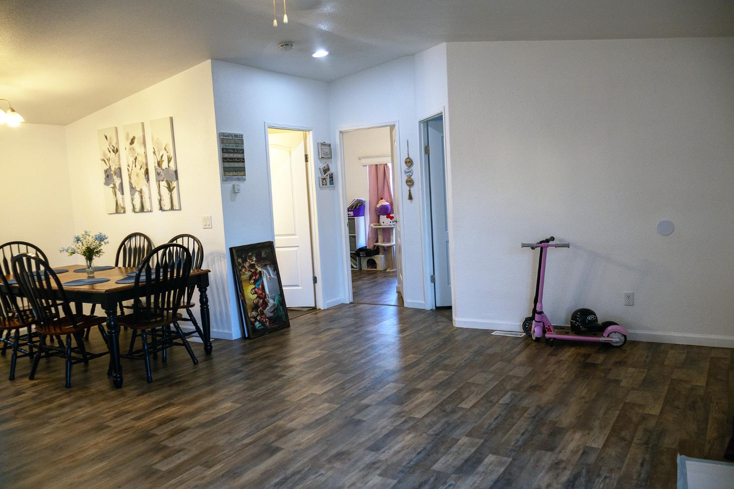 2499 East Gerard Avenue, Unit 123 Merced, CA 95341 - Photo 10 of 15 a view of a room with furniture and wooden floor