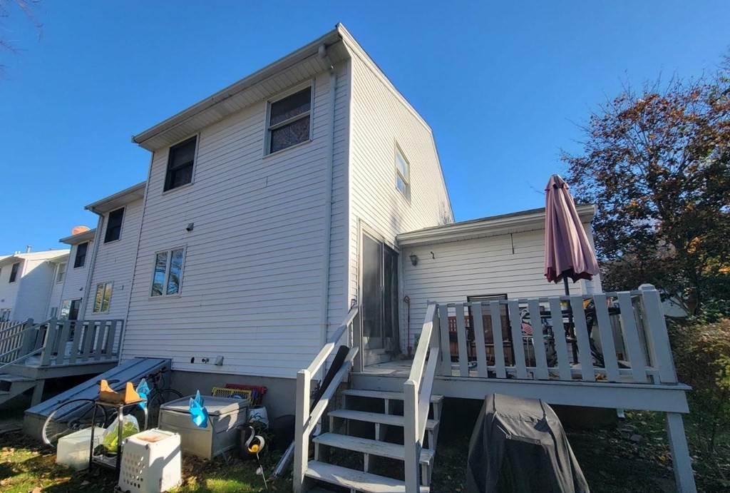 1 Eagan Place, Unit 1 Peabody, MA 01960 - Photo 2 of 3 a view of a house with wooden deck
