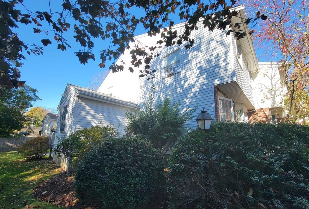 1 Eagan Place, Unit 1 Peabody, MA 01960 - Photo 3 of 3 a backyard of a house with lots of green space