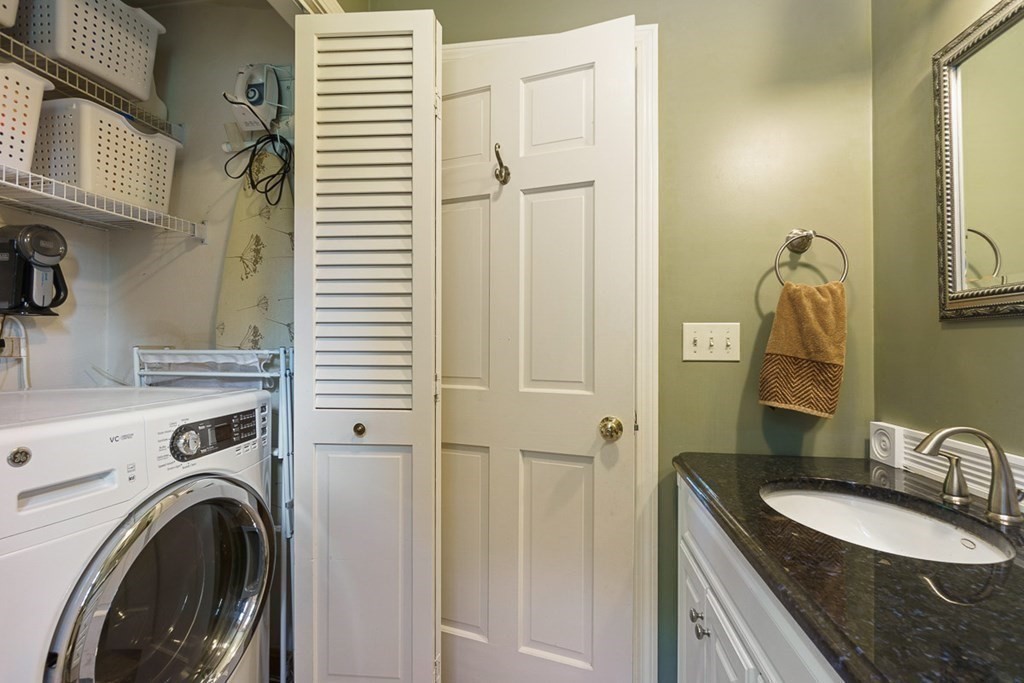 26 Watson Lane Rutland, MA 01543 - Photo 14 of 42 a bathroom with a granite countertop sink and a washing machine