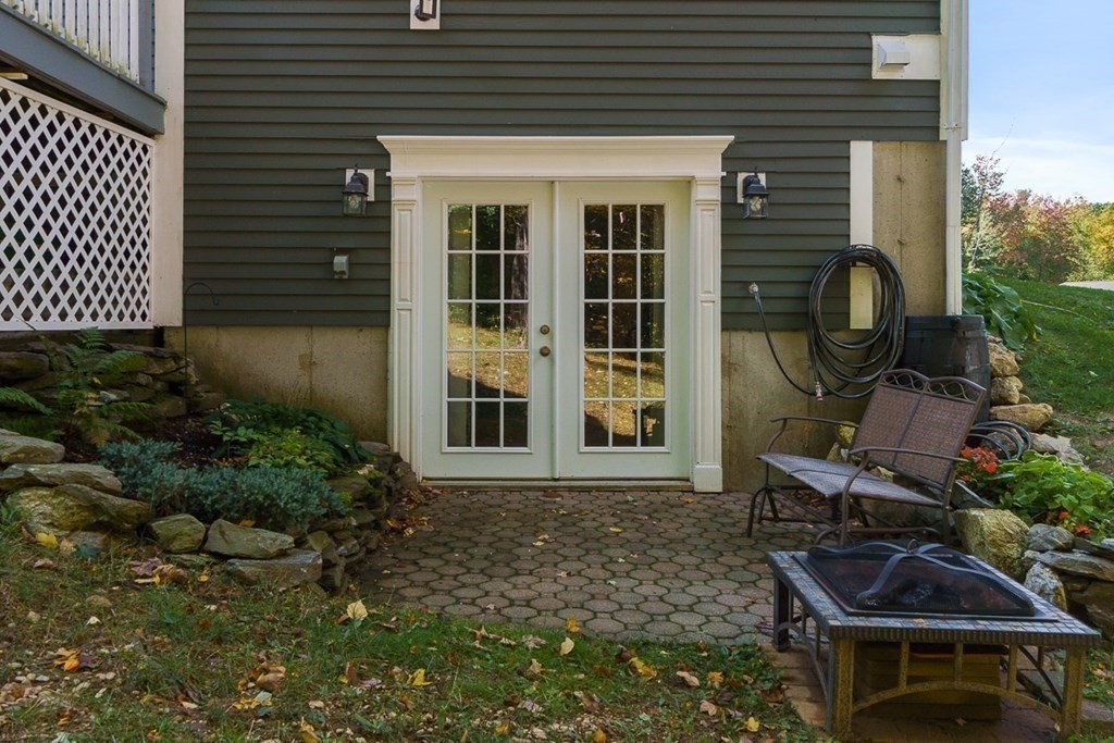 26 Watson Lane Rutland, MA 01543 - Photo 35 of 42 a backyard of a house with outdoor seating