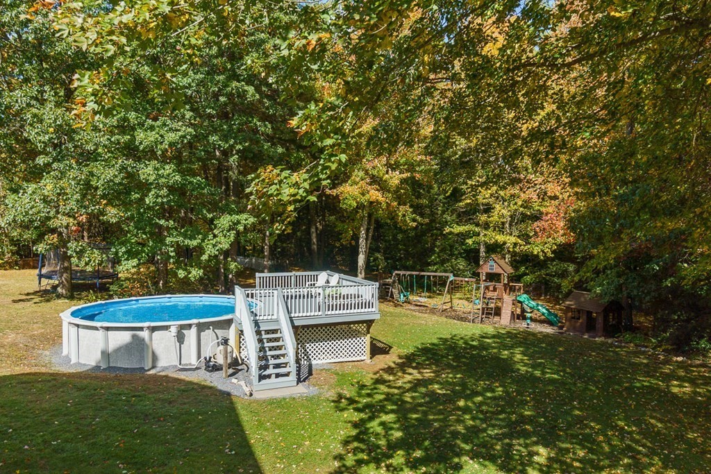 26 Watson Lane Rutland, MA 01543 - Photo 5 of 42 a view of a house with a backyard porch and sitting area