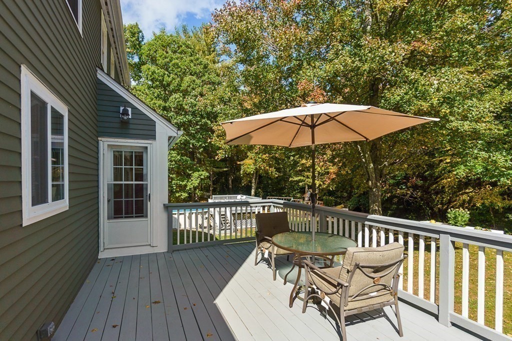 26 Watson Lane Rutland, MA 01543 - Photo 7 of 42 a view of a chair and table on the wooden floor