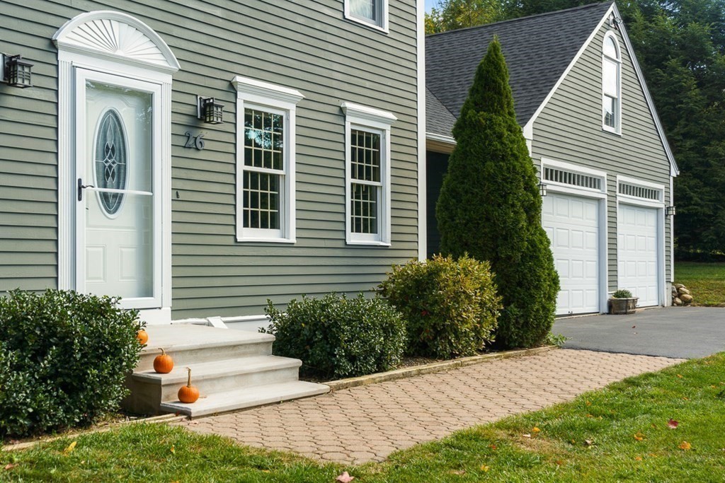 26 Watson Lane Rutland, MA 01543 - Photo 8 of 42 a view of a house with a yard and plants