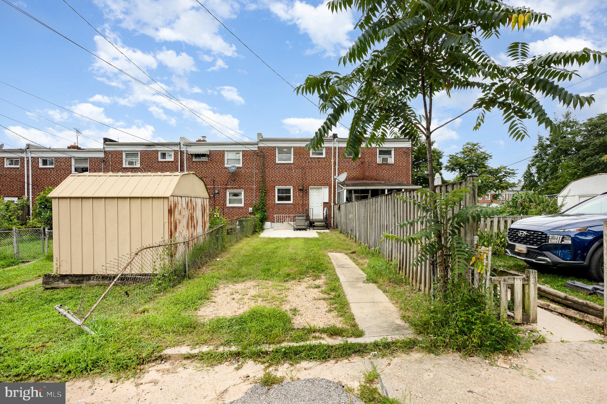 4113 Townsend Avenue Baltimore, MD 21225 - Photo 21 of 24 Backyard large enough to fit multiple cars