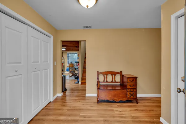 a view of a dining area with furniture and a chandelier