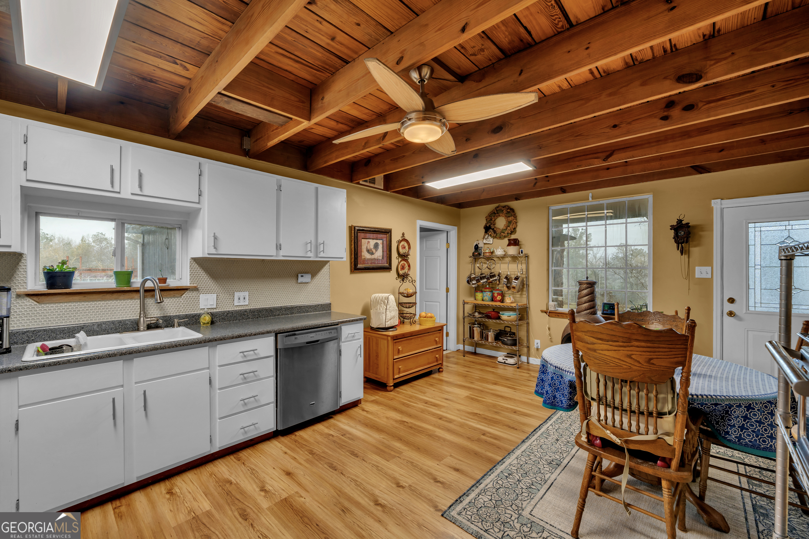 271 Dr Brooks Road Box Springs, GA 31801 - Photo 25 of 63 a large kitchen with a large window and wooden cabinets