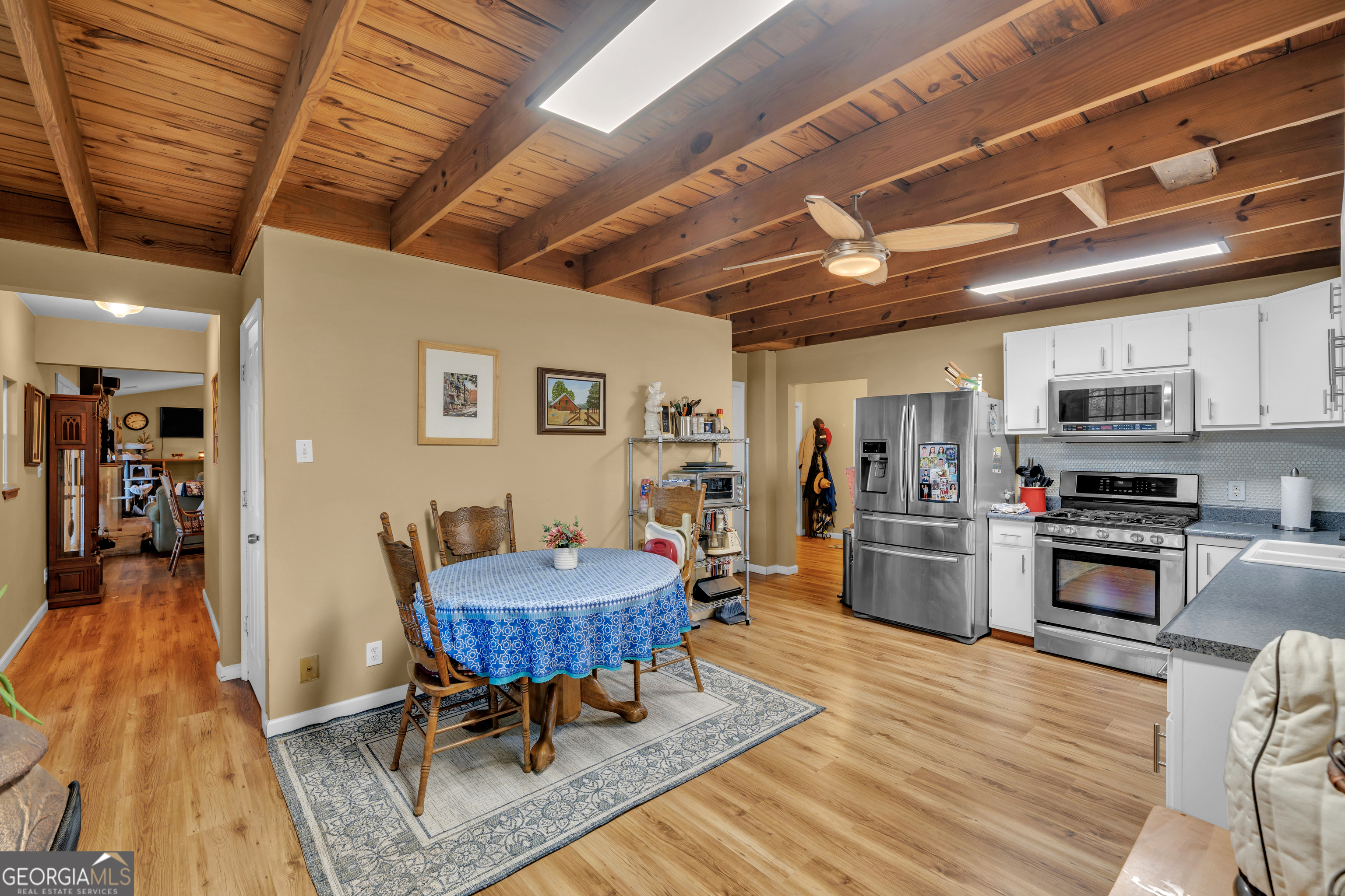 271 Dr Brooks Road Box Springs, GA 31801 - Photo 26 of 63 a living room with stainless steel appliances kitchen island furniture and a wooden floor