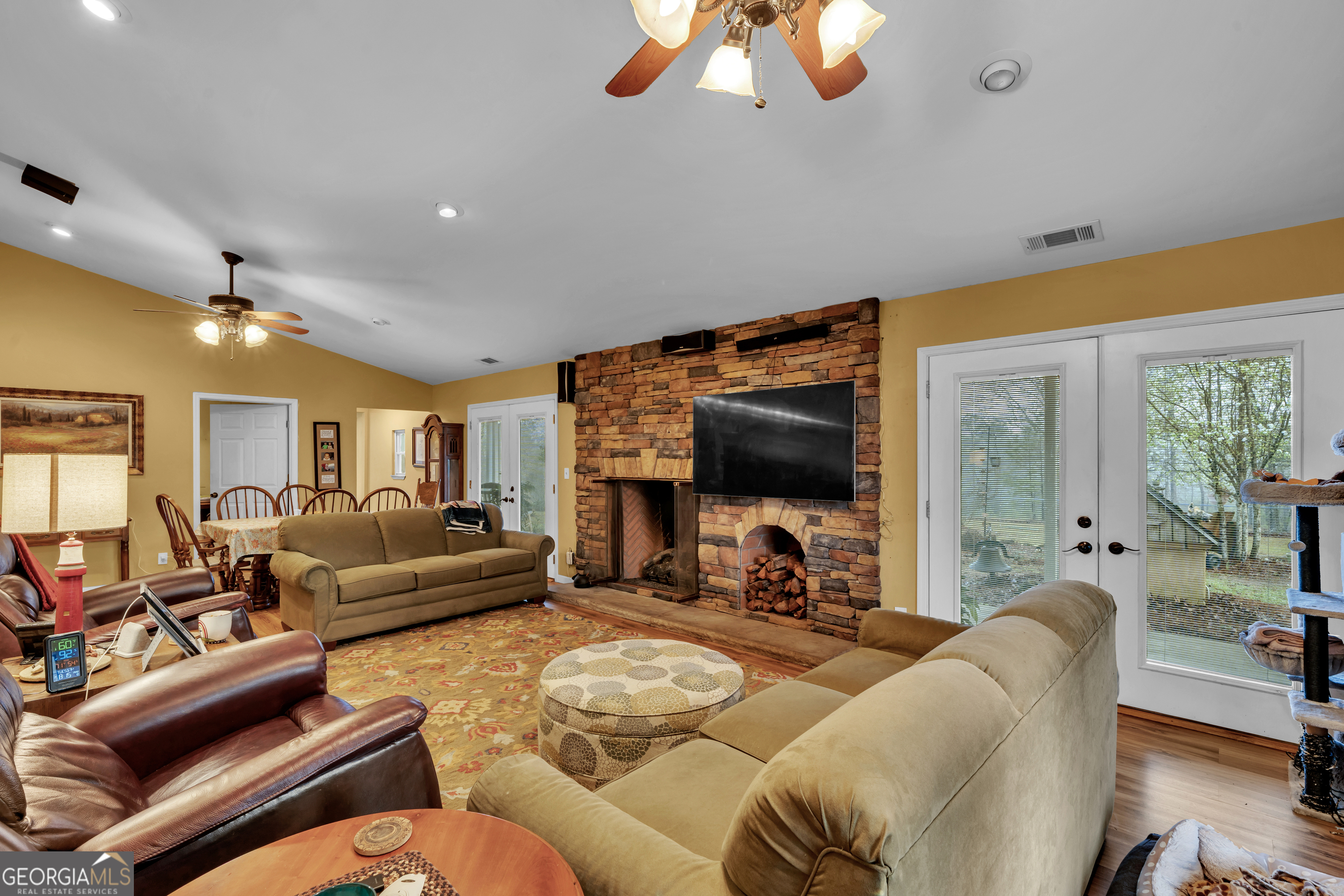 271 Dr Brooks Road Box Springs, GA 31801 - Photo 33 of 63 a living room with furniture a flat screen tv and a large window