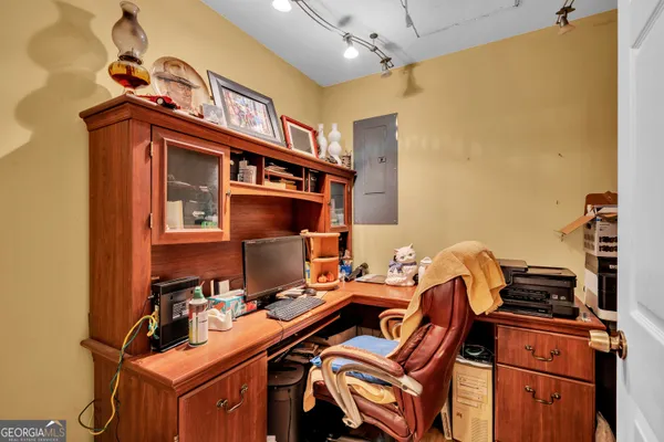 a bedroom with a bed and chair