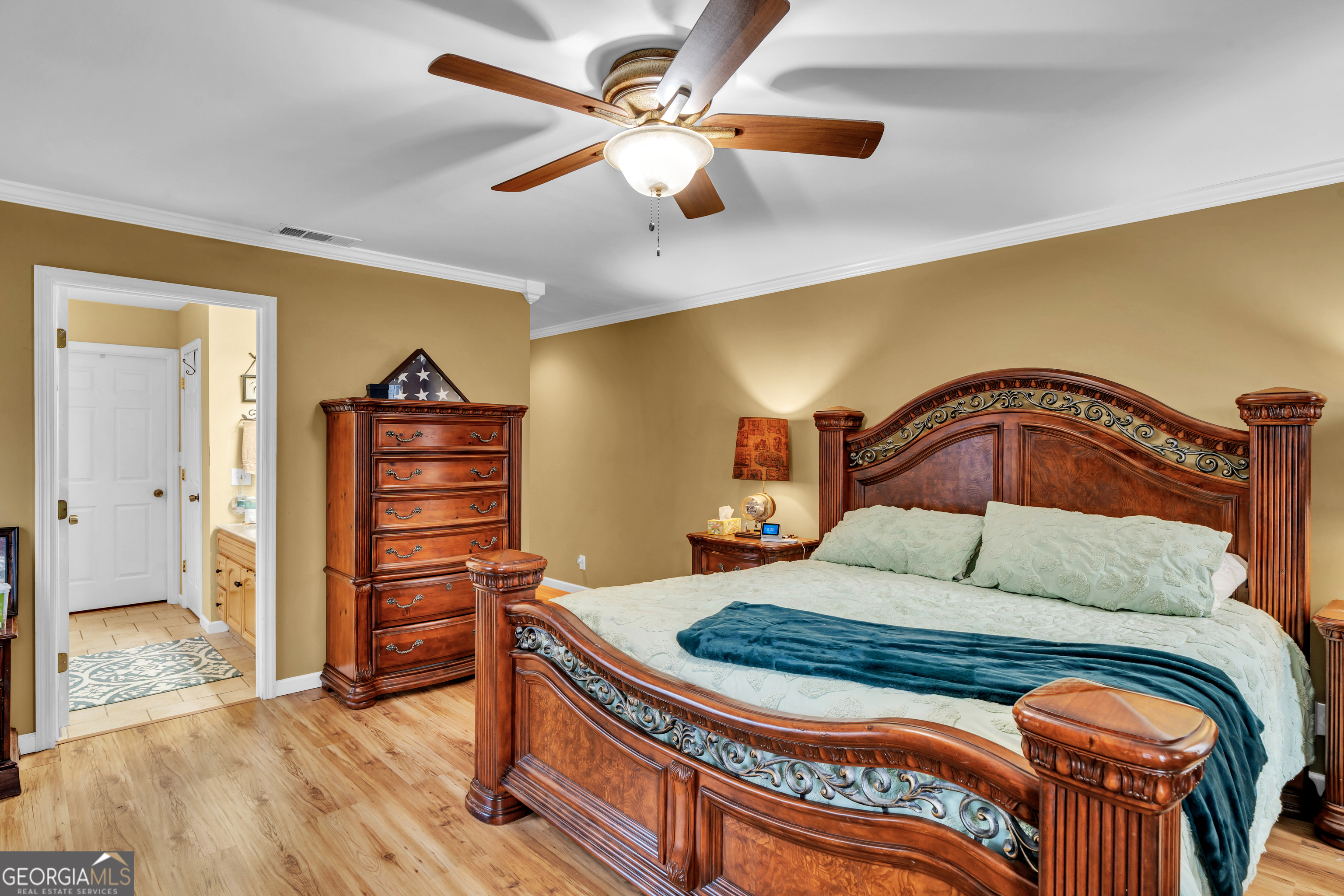 271 Dr Brooks Road Box Springs, GA 31801 - Photo 36 of 63 a bedroom with a bed and wooden floor