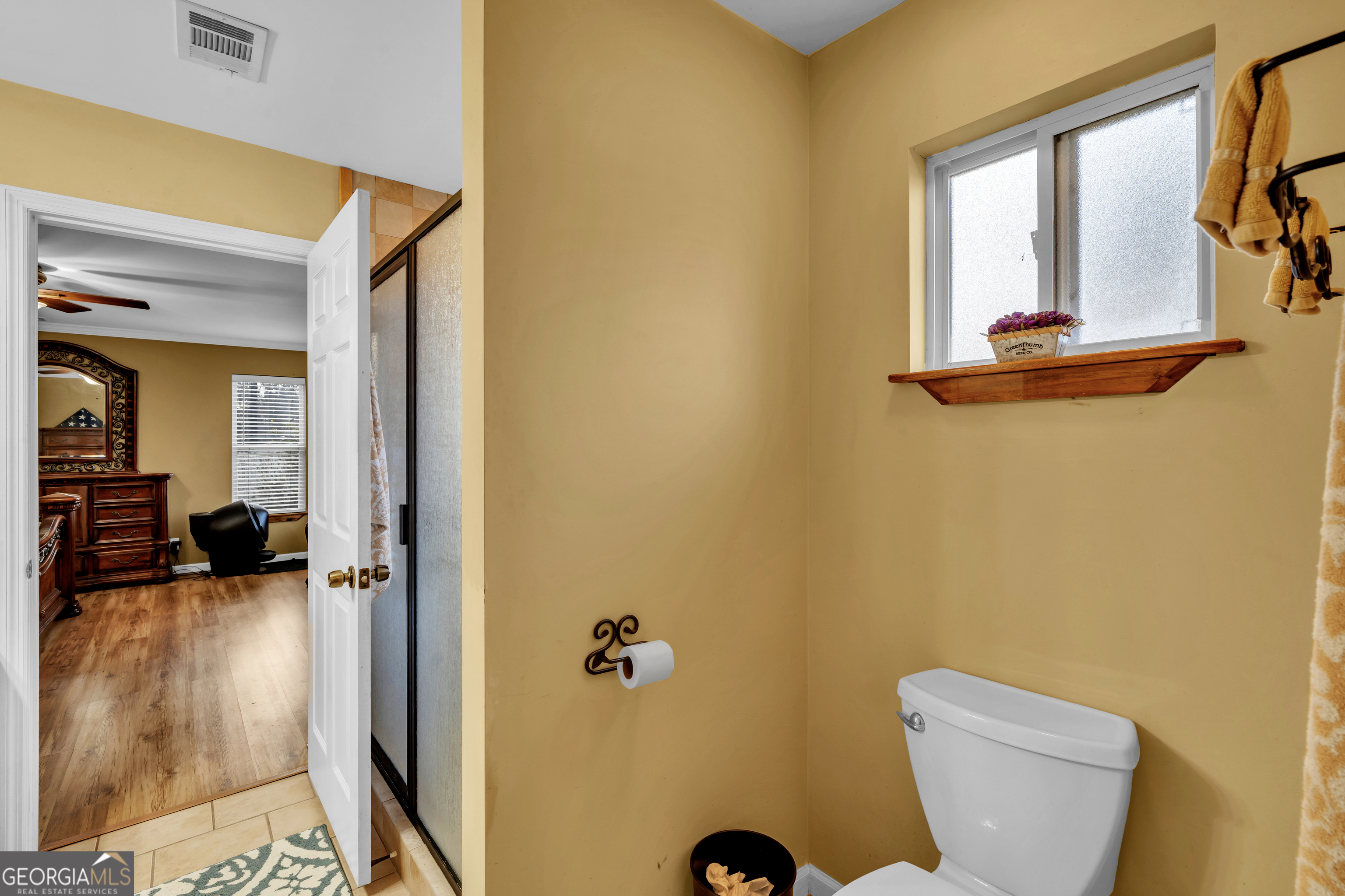 271 Dr Brooks Road Box Springs, GA 31801 - Photo 38 of 63 a bathroom with a sink a toilet and a mirror