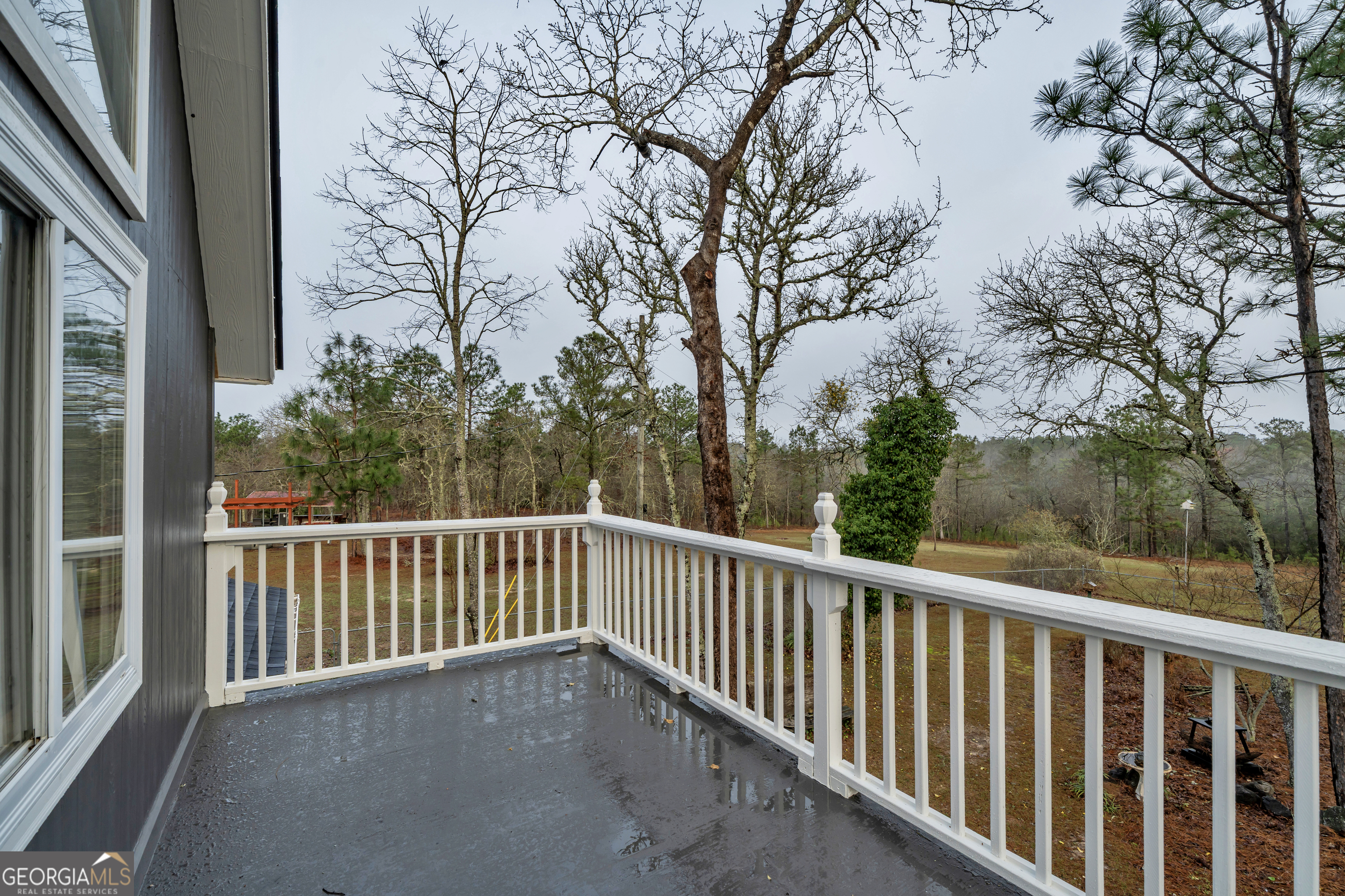 271 Dr Brooks Road Box Springs, GA 31801 - Photo 44 of 63 a view of a balcony with trees