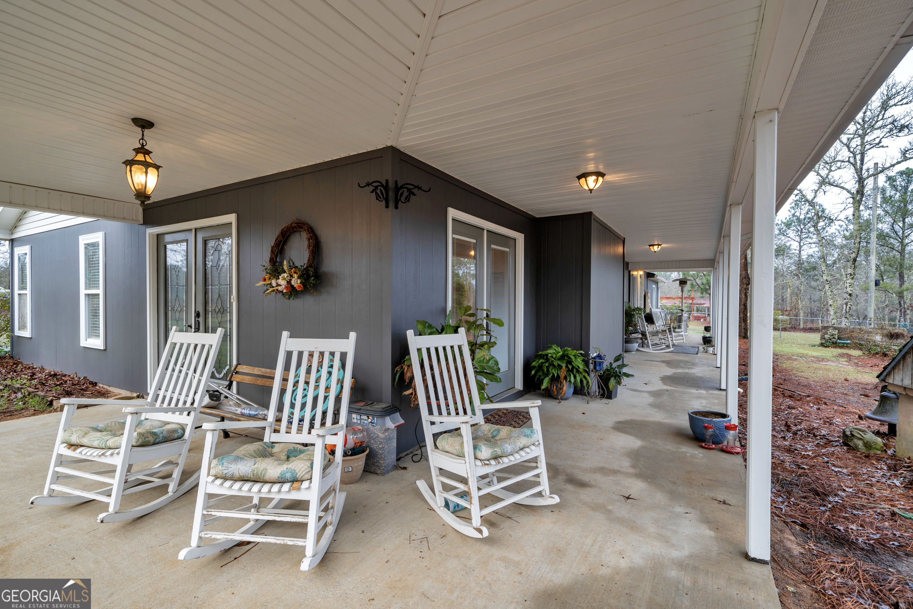 271 Dr Brooks Road Box Springs, GA 31801 - Photo 50 of 63 a view of patio with a table and chairs and potted plants
