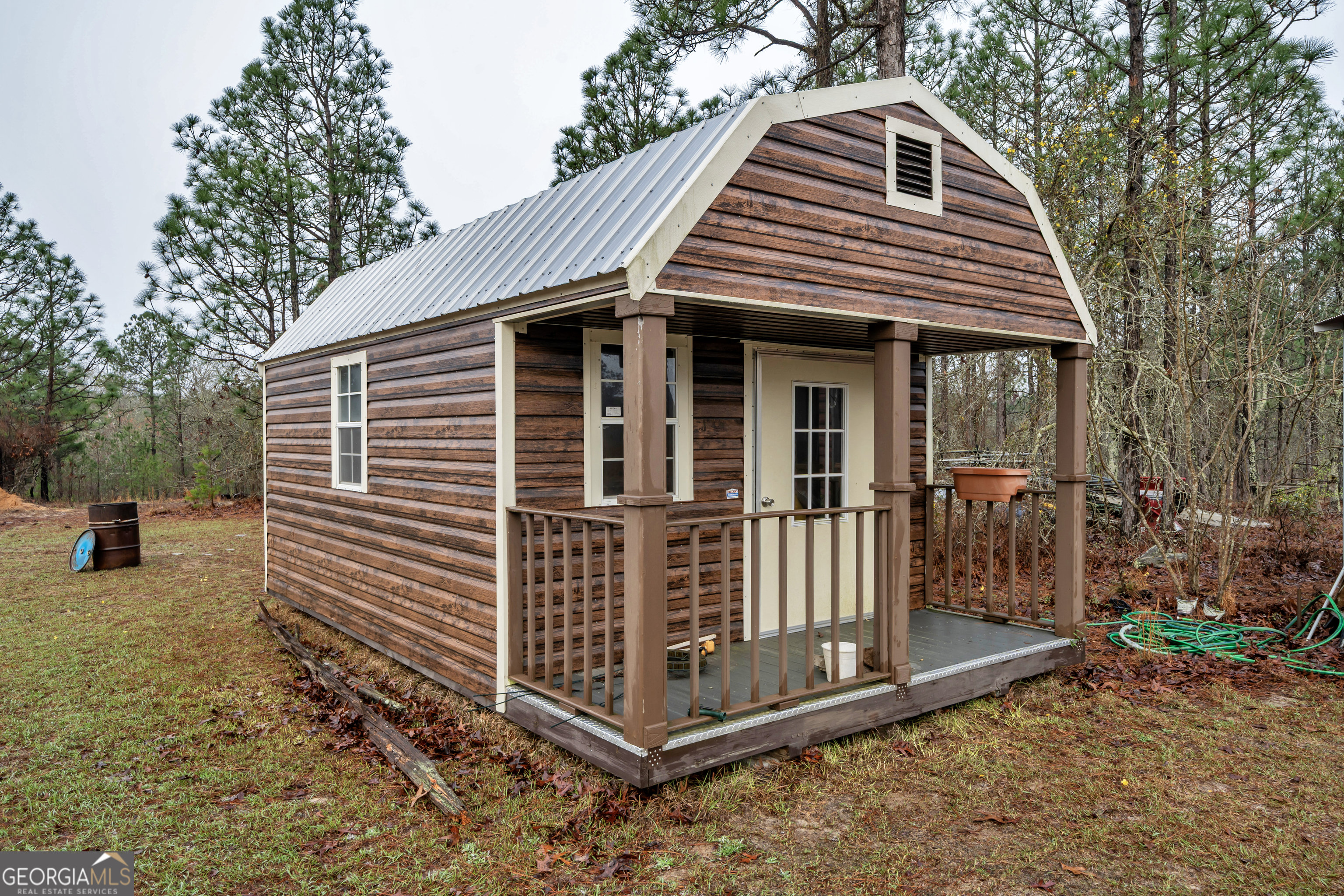 271 Dr Brooks Road Box Springs, GA 31801 - Photo 59 of 63 a view of a house with a yard and wooden fence