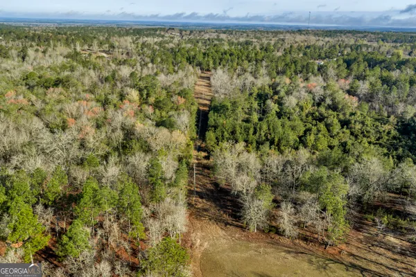 a view of a yard with an outdoor seating