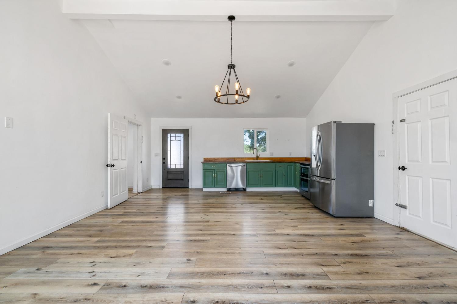 7145 Superior Town Road Lincoln, CA 95648 - Photo 20 of 94 a view of a kitchen with a refrigerator wooden floor and a ceiling fan