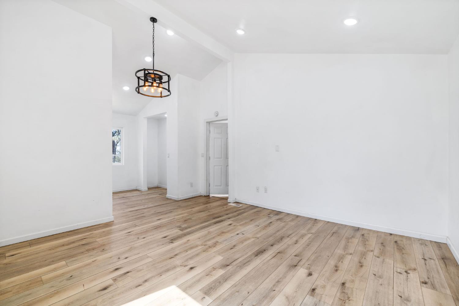 7145 Superior Town Road Lincoln, CA 95648 - Photo 21 of 94 an empty room with wooden floor and windows