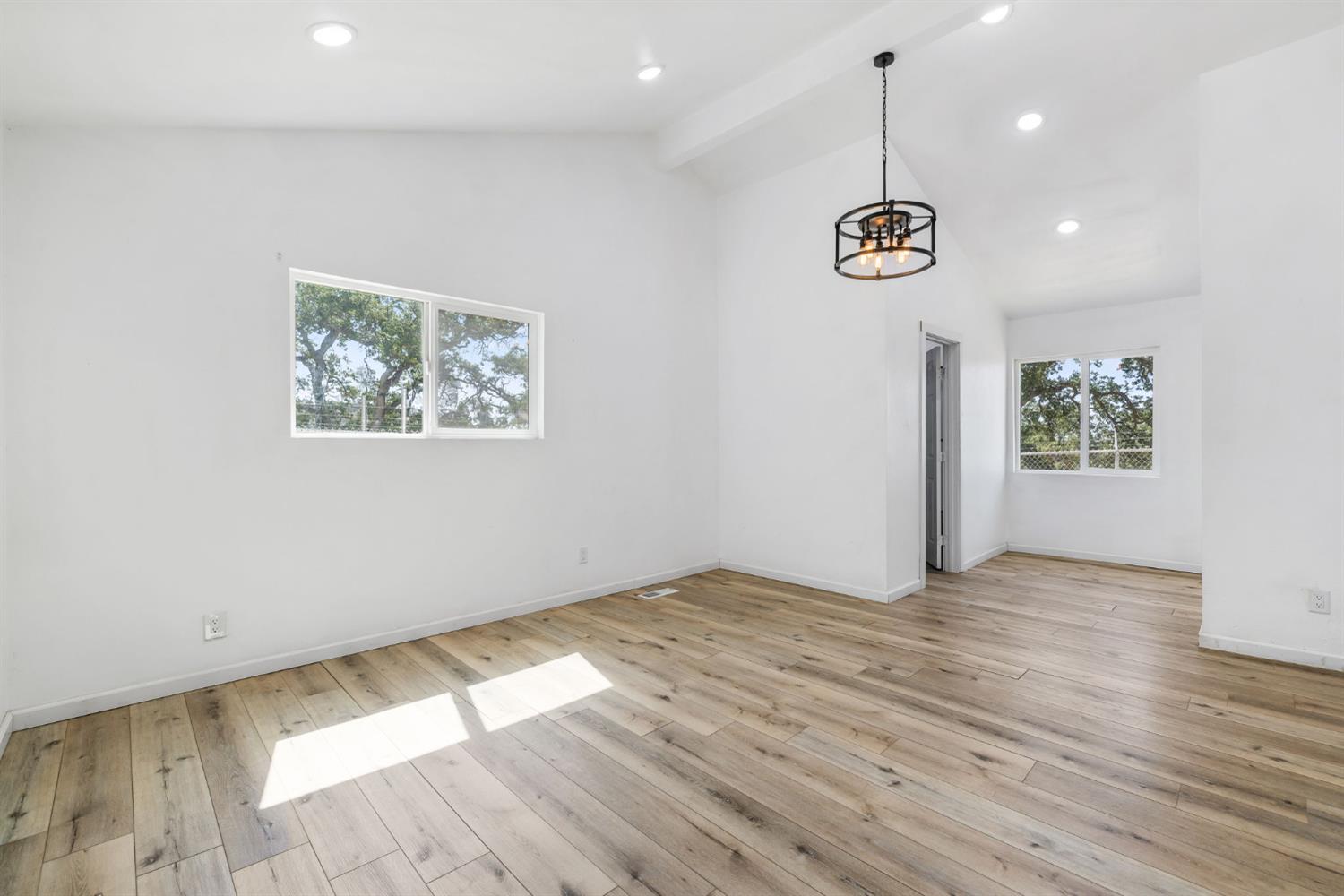 7145 Superior Town Road Lincoln, CA 95648 - Photo 22 of 94 a view of an empty room with wooden floor and window