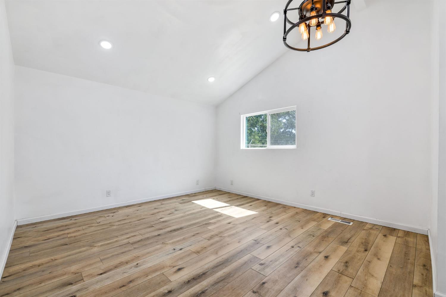 7145 Superior Town Road Lincoln, CA 95648 - Photo 23 of 94 a view of a room with wooden floor and window