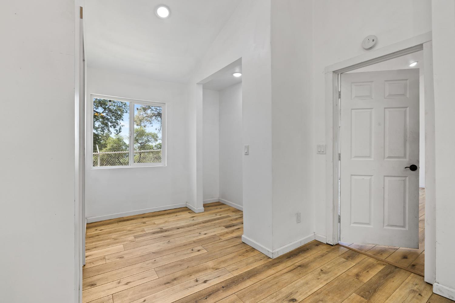 7145 Superior Town Road Lincoln, CA 95648 - Photo 25 of 94 a view of an empty room with wooden floor and a window