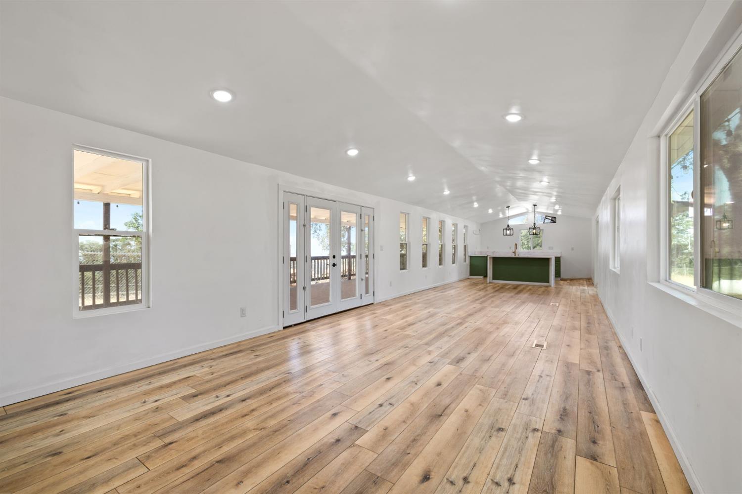 7145 Superior Town Road Lincoln, CA 95648 - Photo 30 of 94 a view of empty room with wooden floor and fireplace