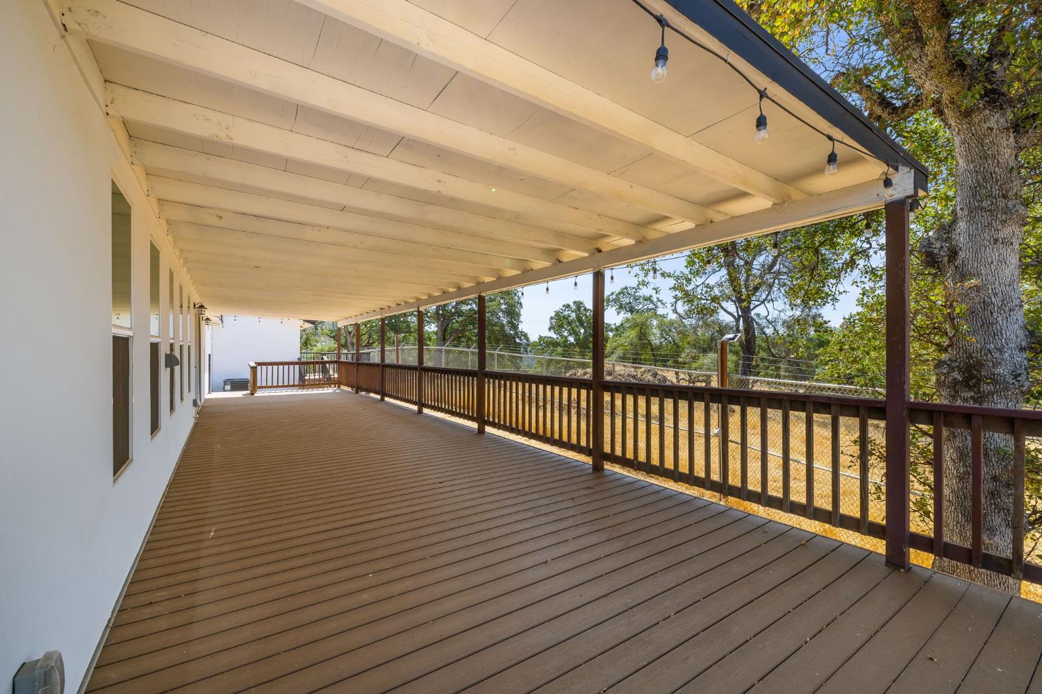 7145 Superior Town Road Lincoln, CA 95648 - Photo 44 of 94 a view of a balcony with wooden floor and fence