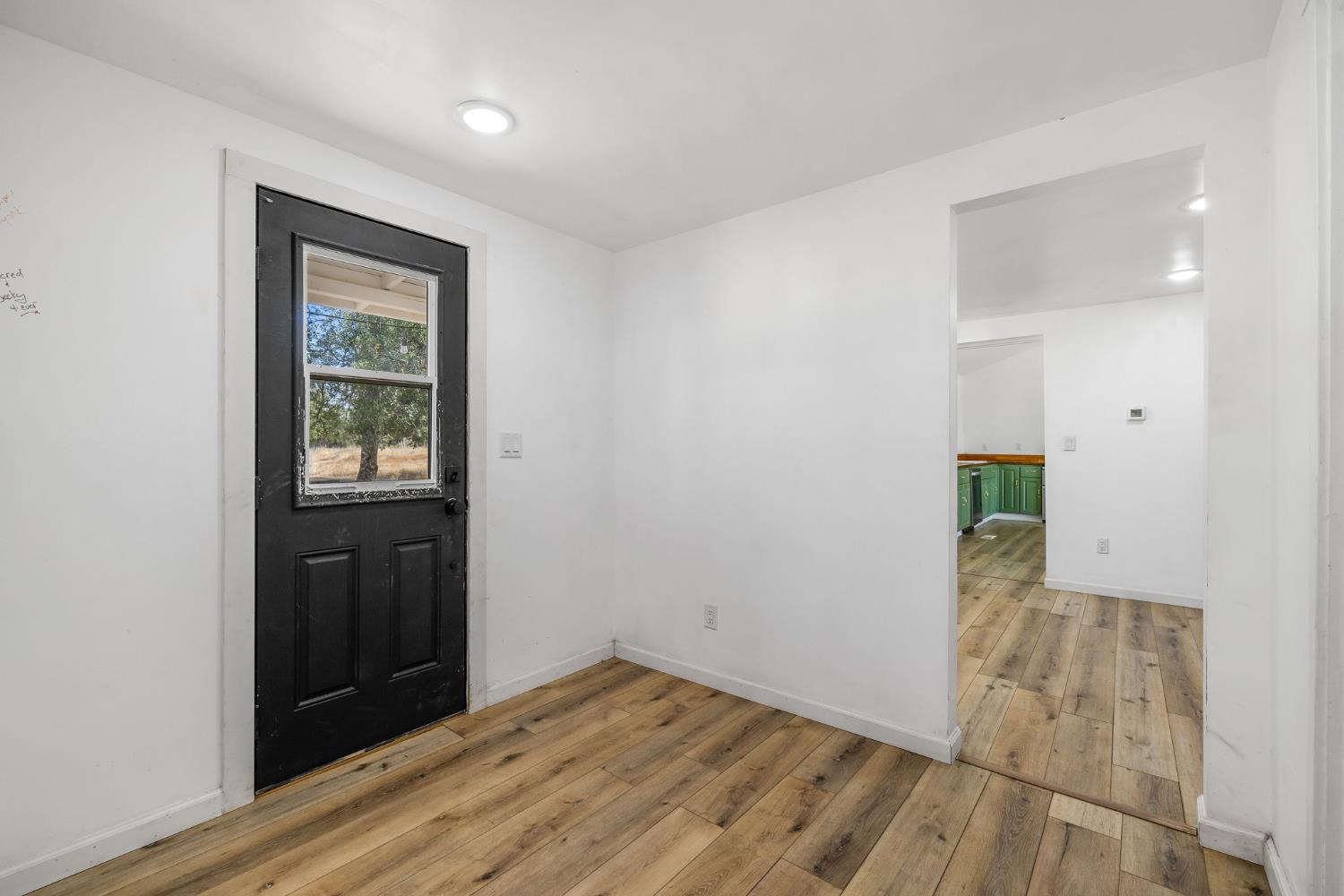7145 Superior Town Road Lincoln, CA 95648 - Photo 6 of 94 a view of an empty room with wooden floor