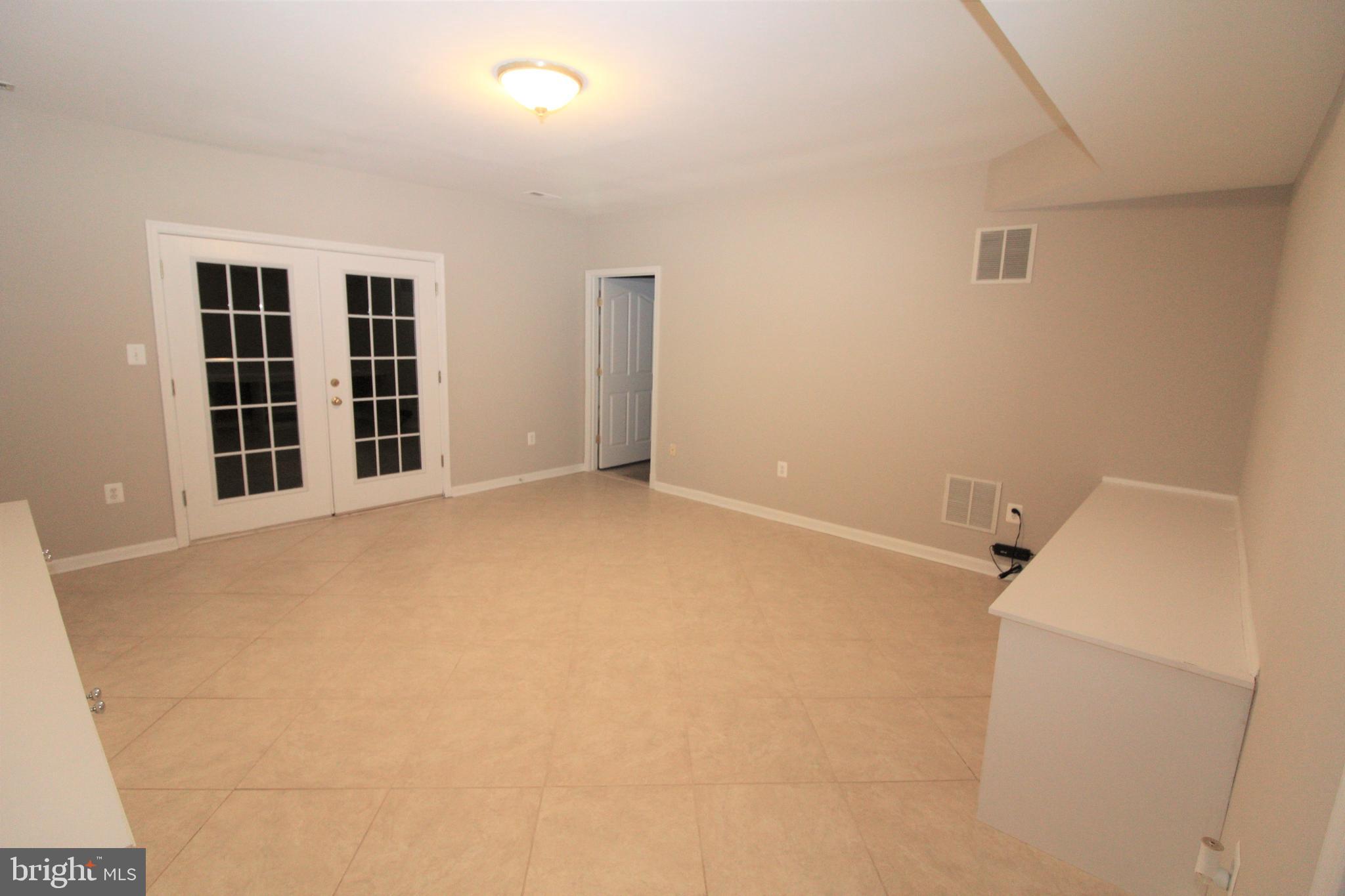 12990 Pintail Road Woodbridge, VA 22192 - Photo 26 of 37 Lower Level rec Room With Builtins