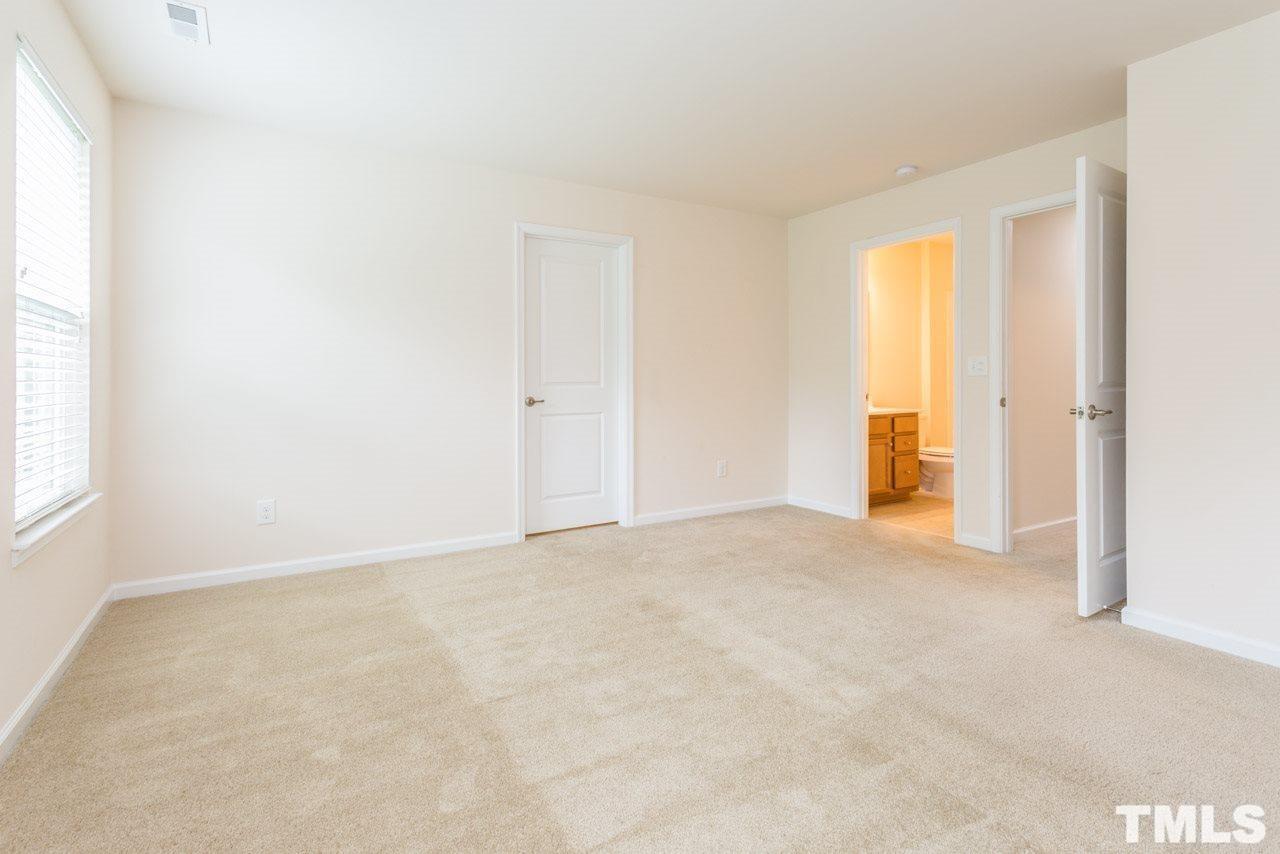 473 Panorama View Loop Cary, NC 27519 - Photo 11 of 17 a view of an empty room with a window