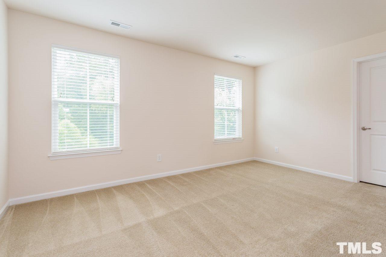 473 Panorama View Loop Cary, NC 27519 - Photo 12 of 17 an empty room with windows