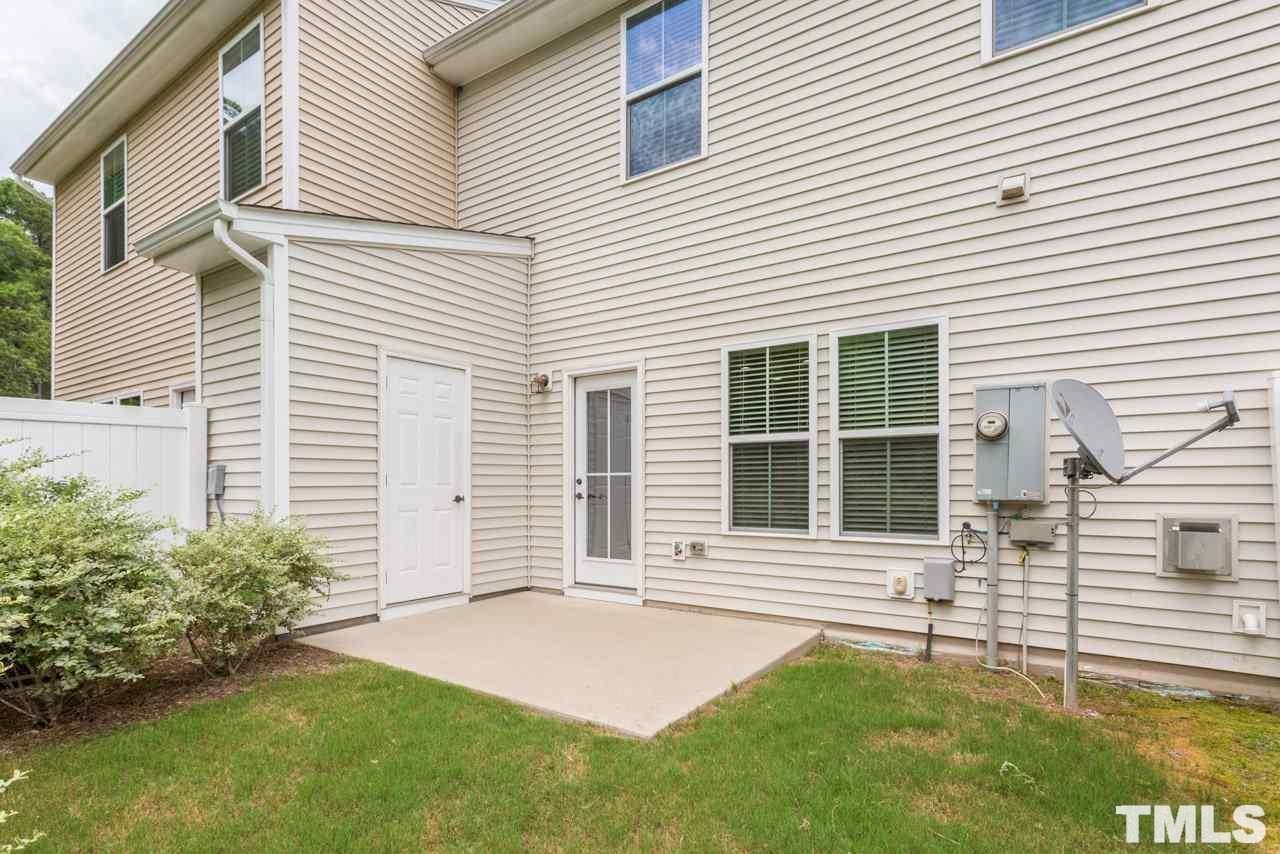 473 Panorama View Loop Cary, NC 27519 - Photo 17 of 17 a front view of a house with a yard and garage