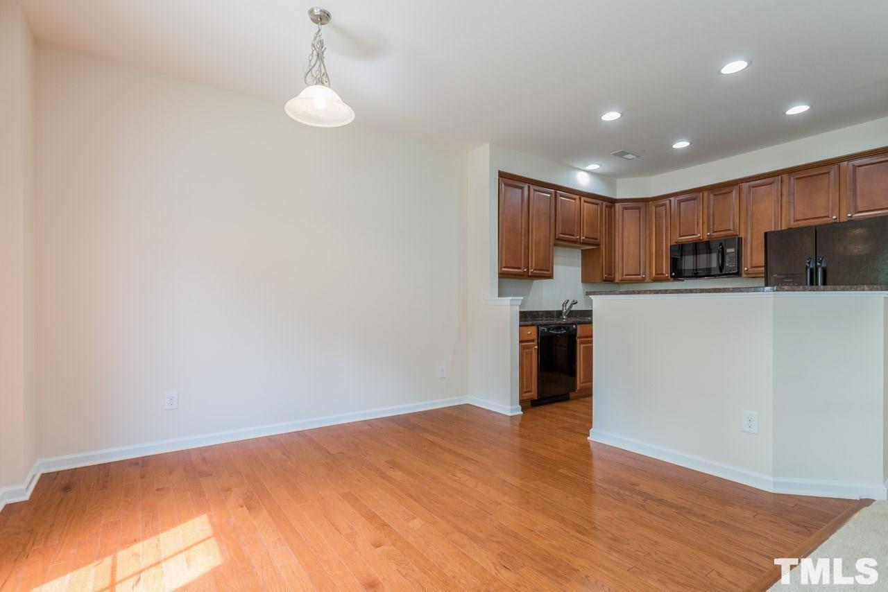 473 Panorama View Loop Cary, NC 27519 - Photo 6 of 17 a kitchen with granite countertop white cabinets and stainless steel appliances