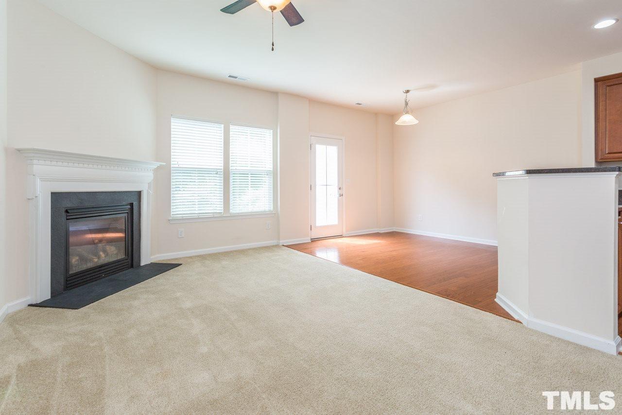 473 Panorama View Loop Cary, NC 27519 - Photo 8 of 17 an empty room with windows and fireplace