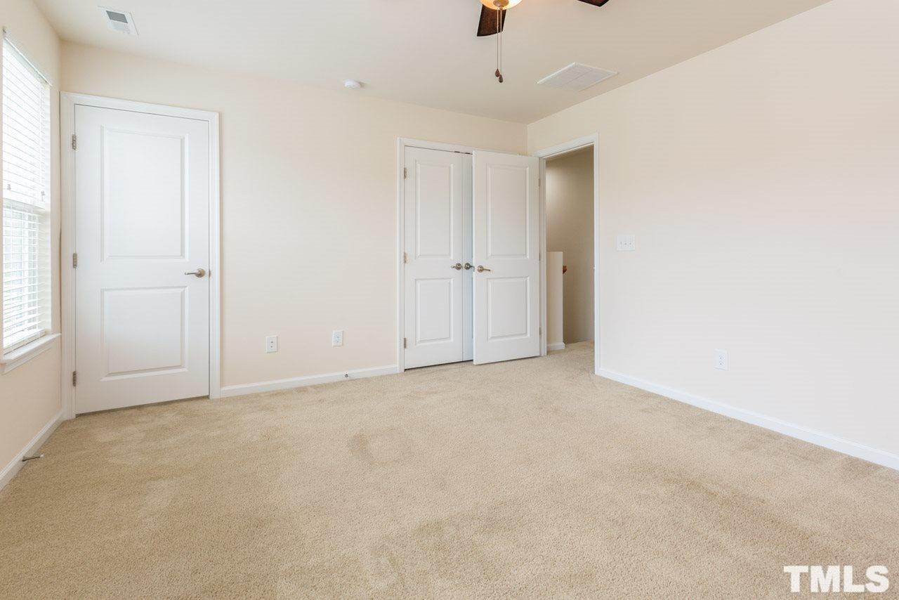 473 Panorama View Loop Cary, NC 27519 - Photo 9 of 17 an empty room with closet and windows