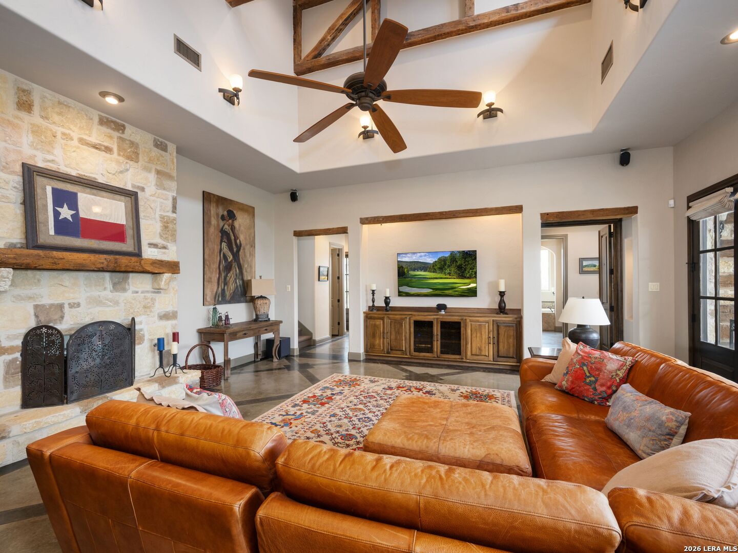 2601 B And R Road Utopia, TX 78884 - Photo 21 of 70 a living room with furniture a fireplace and a flat screen tv